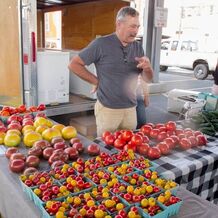 Picture of Daystar Farms selling tomatoes at farmers market